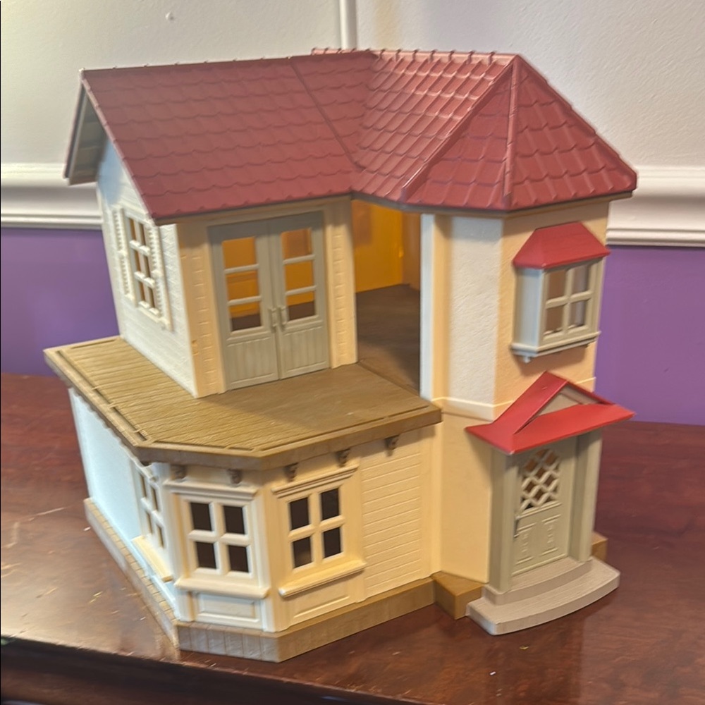 Charming Dollhouse with Red Roof
